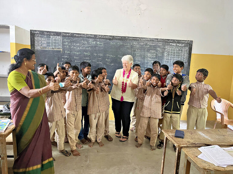 Vicky teaches the class the fun of showing thumbs up