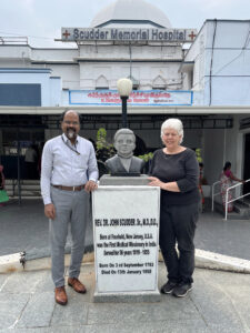 Medical Director Dr. Suresh and me at the Dr. John statue in the hospital's memorial garden.