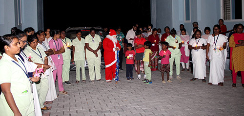 Even the children were there to help Santa sing.