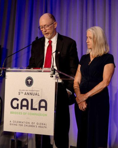 Dr. Jim Taylor addresses the audience as wife Dr. Susan Taylor looks on