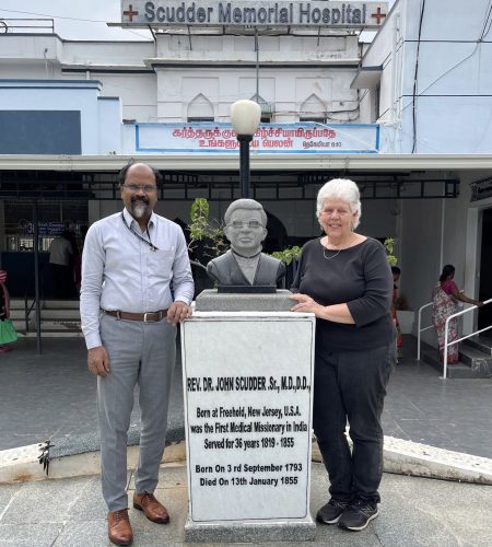 Medical Director Dr. Suresh and me at the Dr. John statue in the hospital's memorial garden.